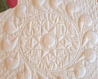 Detail of Antique Trapunto stitched hand made flower basket quilt