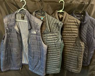 Four XLL Puffy Winter Vests From Eddie Bauer North Face And Andrew Marc