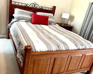 Queen bed frame with metal accent on headboard