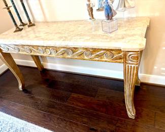 Striking carved console with stone top