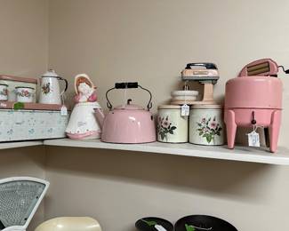 pink enamel whistling kettle and ceramic cookie jar