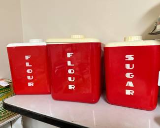 red and white plastic Lustro-Ware kitchen canisters Mid century
