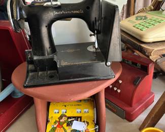 Toy sewing machine and cash register