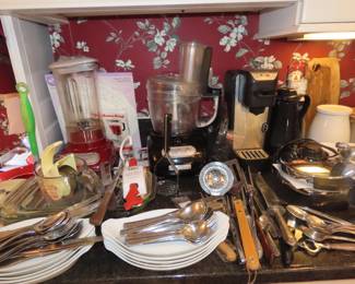 Kitcheaid blender, Cuisinart food processor, Mr Coffee Kcup coffee maker, Pyrex, utensils, flatware