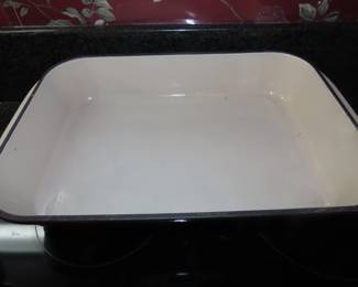 Brown Le Crueset casseroles and dishes.