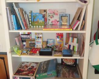 Bookcase full childrens books, games and toys.