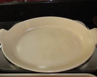 Brown Le Crueset casseroles and dishes.