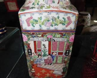 One of two matching Chinese Canton Famille Rose vases.
