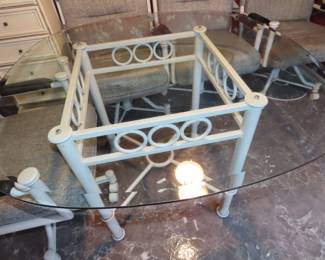 Kitchen table and four rolling chairs.