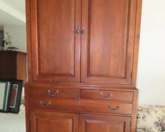 Large two piece TV/Clothing armoire with drawers.