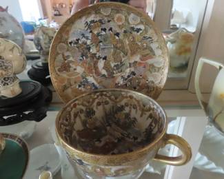 One of two Satsuma cups and saucers Gyokuzau Shiazu family crest, Meiji period.