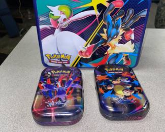 Collection of Pokémon cards, including holographic cards