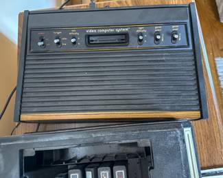 Vintage Atari Video Computer System with Controllers and Game Cartridges