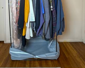 Assorted clothing including jackets, sweaters, shirts, and everyday apparel