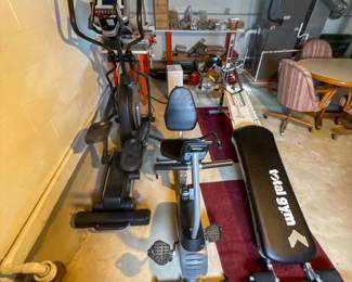 Assorted workout equipment including weights and fitness accessories