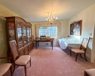 Dining Room Overview with China, Crystal, Table, and Chairs