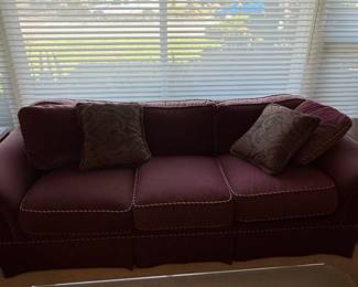 Traditional Burgundy Velvet Sofa with Rolled Arms and Skirted Base