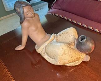 Terracotta Figurine of a Reclining Woman with a Pot
