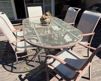 Oval Glass Top Patio Dining Set with Four Sling Chairs