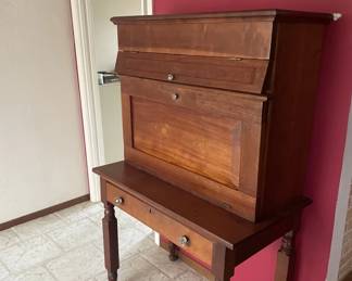 Interesting and beautiful chest/cabinet - antique.  4 compartments.  Top lid opens to reveal storage; second area opens to small slots; pull down reveals 'secretary' storage and 4th is drawer.