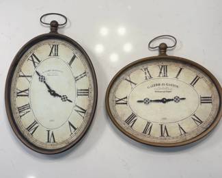 Two Oval Wall Clocks