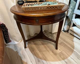 Round mahogany side table with drawer and tripod brace