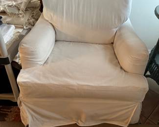 Club chair arm chair with white soft cover, shown with zipper up a bit, velvet chair underneath 