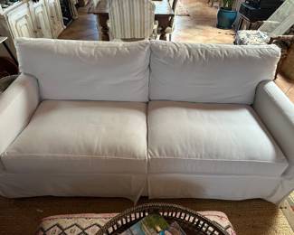 Sofa with white slipcovers on