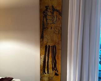 Metal wall art lady with dog is 9 inches wide by 45 inches tall and 2 inches deep