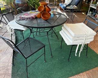 42 inch diameter rod iron patio set has different seating options for cushions