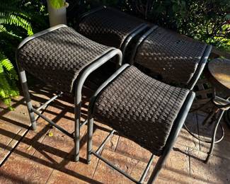 Four barstools three with 28 inch seat one with 24 inch high seat one of large larger has brake in top plastic lattice. Weaving can strap cushions over they are available for purchase.
