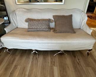 Custom slipcover on sofa/loveseat can be accessorized many ways