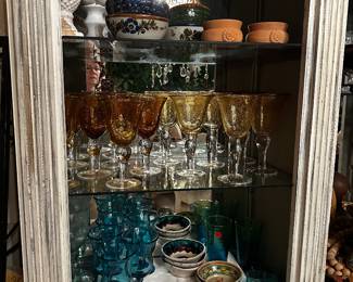 Pottery bowls and hand blown glass goblets Thom wear in amber, gold and aqua with clear stems