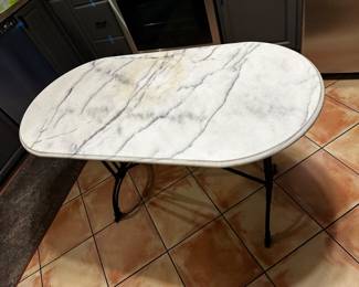 Marble top table 24 x 47” top on metal base is 30 high