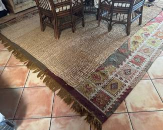 One of two room size kilim rugs about 8x10 feet, with jute rug overlay, sold separately 