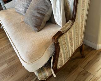 Slipcover pulled back to reveal good condition underneath 