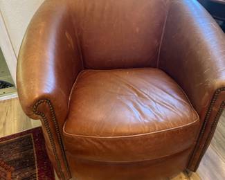 Swivel rocker in brown leather, shown naked