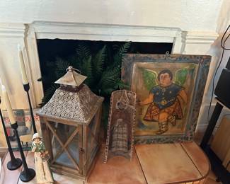 Primitive angle painting on wood, iron candlesticks, 