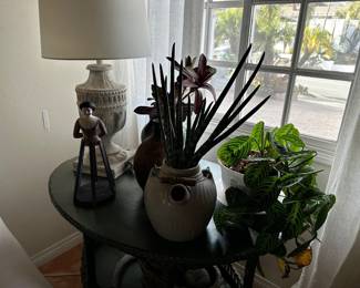 Painted wood table lamp, wooden doll with slat skirt, pottery pictures, and planters with faux greens