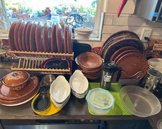 Mexican pottery dishes, 18 plates, 7 oval plates, woven chargers/holders, 
