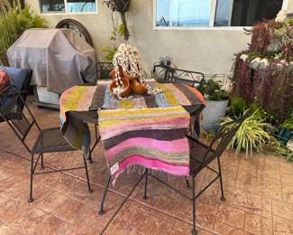 Black wrought iron patio set as found