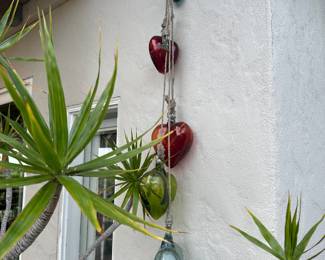 So many fun garden decor items, hanging glass hearts here
