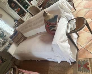 Sofa shown with over cloth over white slipcovers over linen sofa