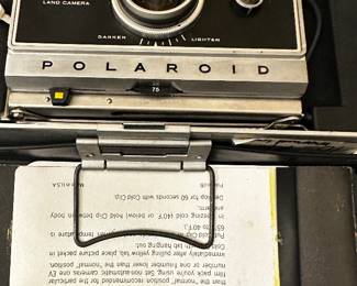 	#107	RA	Two vintage Polaroid cameras with accessories model 210 and 250. -untested	 $ 25.00 		