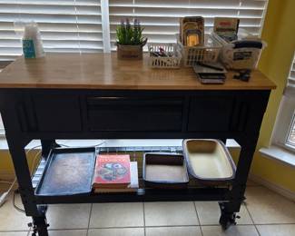 Black kitchen island with butcher block top