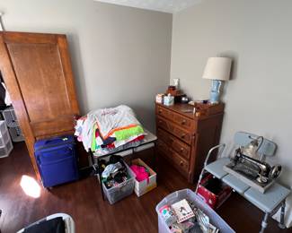 dresser, lamp, clothes luggage