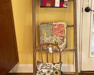 QUILT RACK WITH SEVERAL OF THE QUILTS