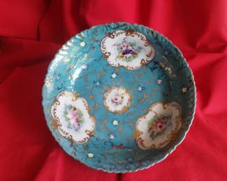 Blue bowl with rose flowers and gold colored oitlined
