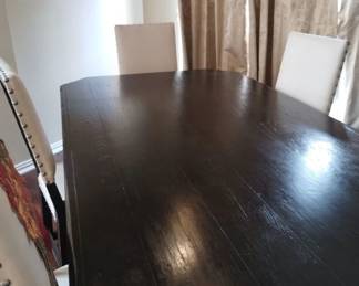 Dark wood table with 6 fabric covered chairs