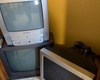 Several vintage television, VCR combos